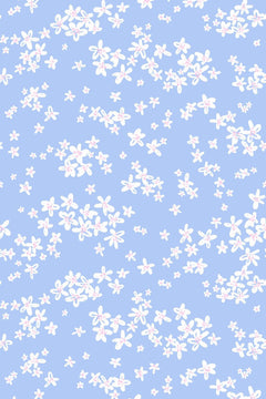 Le décor à plat : nuées de petites fleurs blanches au cœur rose en bandes obliques sur fond bleu pervenche clair.