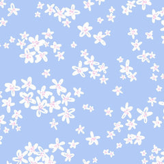 Gros plan de l'impression : fleurette blanche au contour tracé main, cœur ponctué de points rose bonbon et fin trait bleu sur les pétales.
