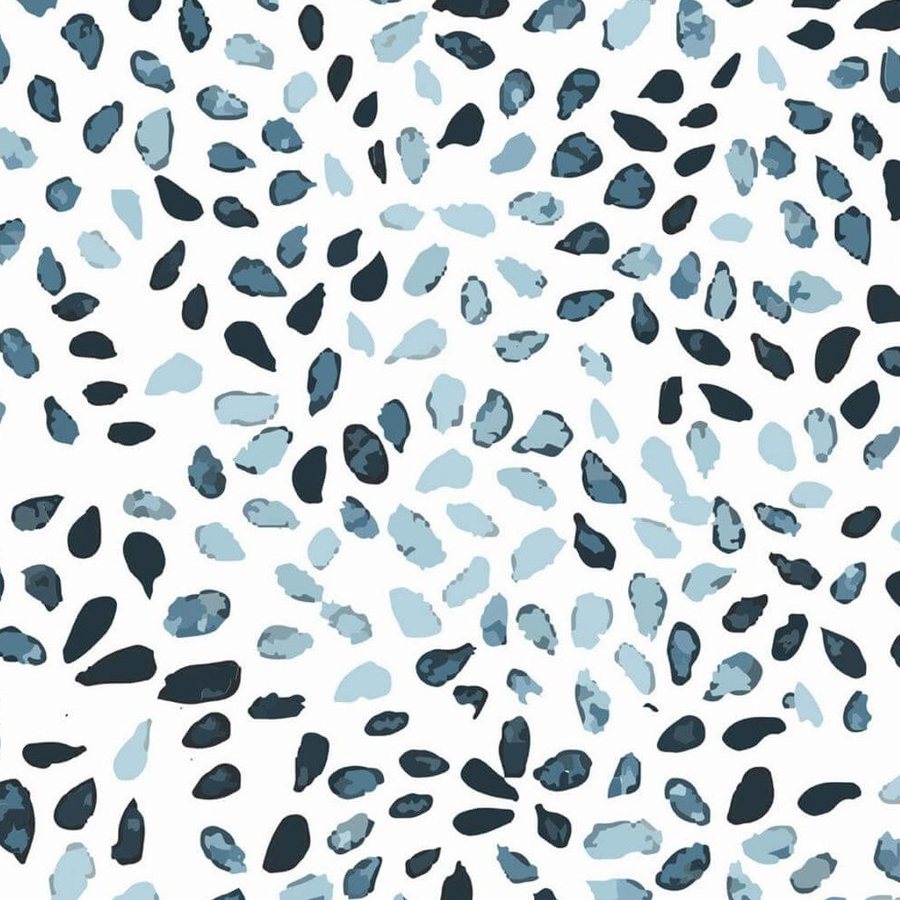 Gros plan de l'impression : le grain d'une touche indigo, plus dense sur son bord, et le blanc du fond autour.