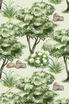 Le décor à plat : arbres aquarellés vert sauge en fleurs blanches, graminées et rochers sur fond vert amande.