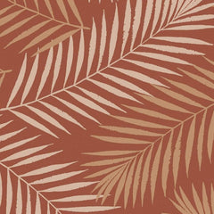 Gros plan de l'impression : folioles d'une palme en deux tons de beige et grain irrégulier du fond terracotta