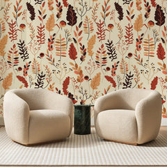 Papier peint panoramique Herbier d'Automne Terracotta, posé sur toute la paroi d'un salon, derrière deux fauteuils en bouclette crème et un guéridon en marbre vert.