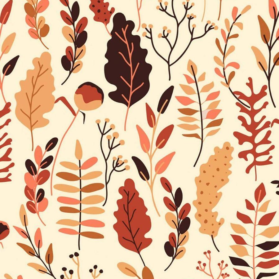 Gros plan sur l'impression, aplat terracotta d'une feuille de chêne et petites baies noires.