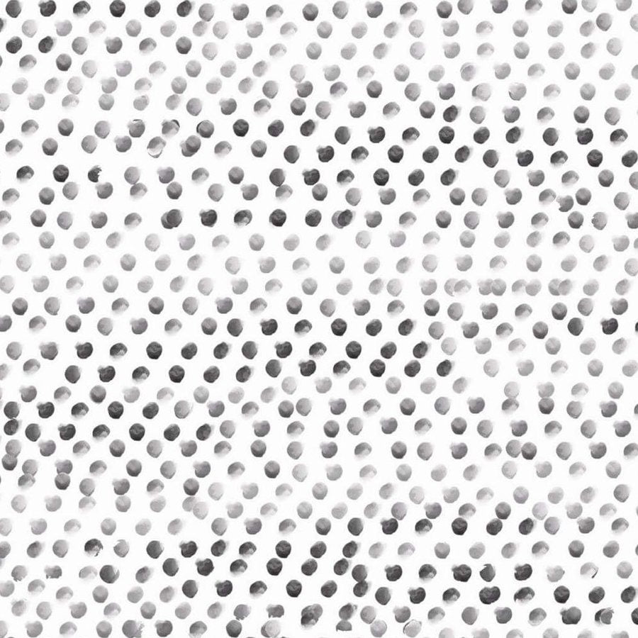Gros plan de l'impression : quelques pois aux bords irréguliers, du gris pâle au gris foncé.