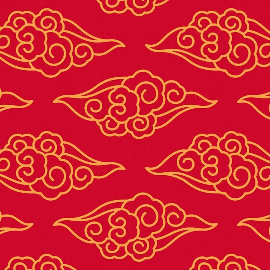 Gros plan de l'impression : les volutes enroulées d'un nuage, trait doré d'épaisseur constante sur rouge.