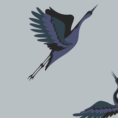 Gros plan de l'impression : le dégradé violet d'un corps de grue et le trait fin d'une patte sur le gris.