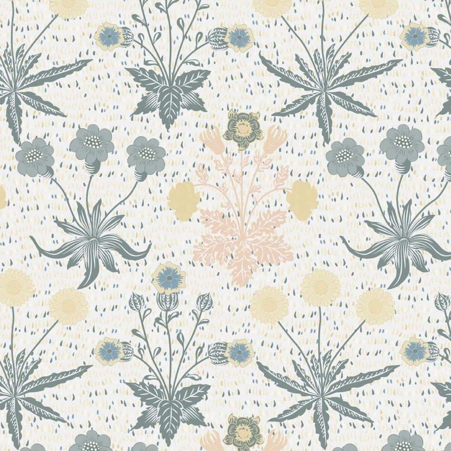 Gros plan sur l'impression : les hachures bleu-gris d'une feuille pointue et le jaune pâle d'une fleur ronde voisine.