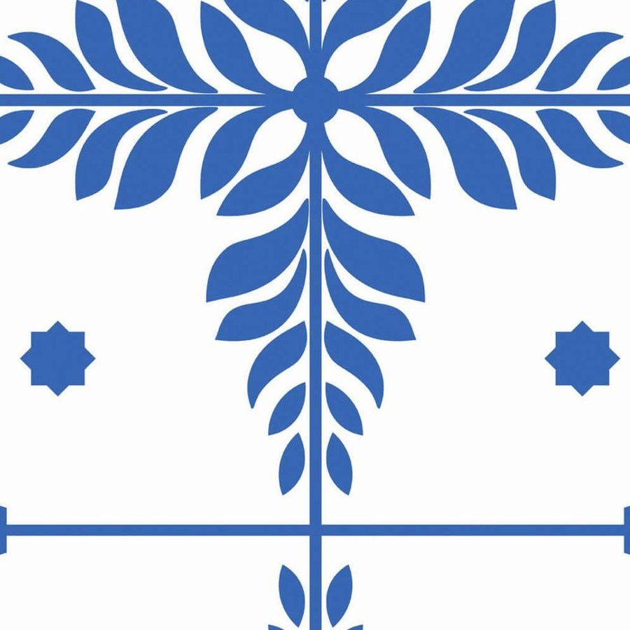 Gros plan de l'impression: le bord tranché d'une feuille cobalt et le filet du carreau sur le blanc.