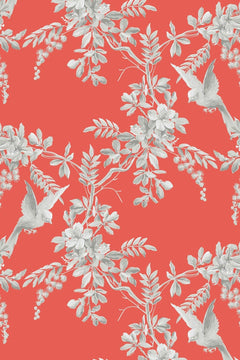Décor à plat : fond corail vif, branches fleuries dessinées en gris et blanc, deux oiseaux gris ailes ouvertes.