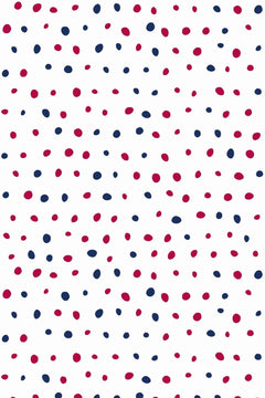 Le décor à plat : pois peints à la main, framboise et bleu marine, semés sur fond blanc.