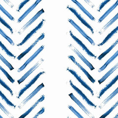 Gros plan sur un trait bleu marine tiré à sec, ses bords piqués de blanc.