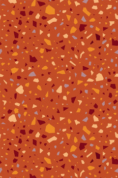 Décor à plat : semis dense d'éclats anguleux crème, ambre, bordeaux et bleu-gris sur un fond rouge terre cuite.