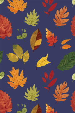 Le décor à plat : feuilles d'érable et de chêne orange, rouille, jaunes et vertes sur fond bleu nuit.