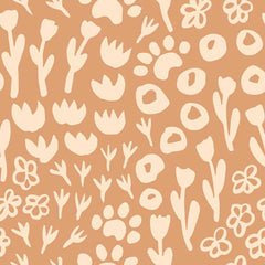 Gros plan de l'impression : tulipe crème en aplat sur le fond terracotta, bord légèrement irrégulier comme découpé aux ciseaux.