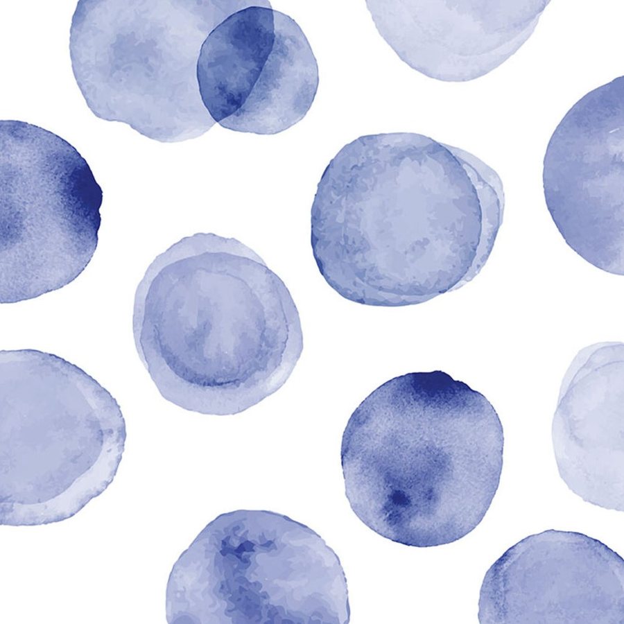 Gros plan de l'impression : le bord chargé de pigment d'un pois indigo et son centre clair.
