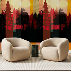 Papier peint panoramique Forêt Rayée au Soleil Couchant, posé sur toute la paroi d'un salon, derrière deux fauteuils en bouclette crème et un guéridon en marbre vert