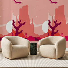 Papier peint panoramique Désert Rose et Lune Blanche, posé sur toute la paroi d'un salon, derrière deux fauteuils en bouclette crème et un guéridon en marbre vert